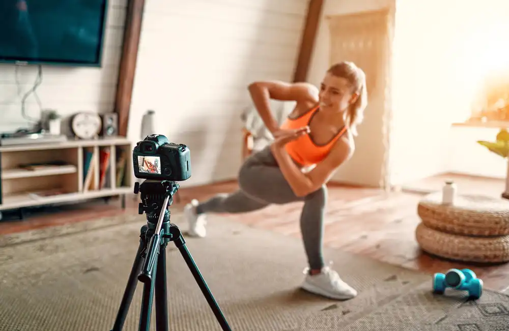 Athletic woman trainer makes marketing video